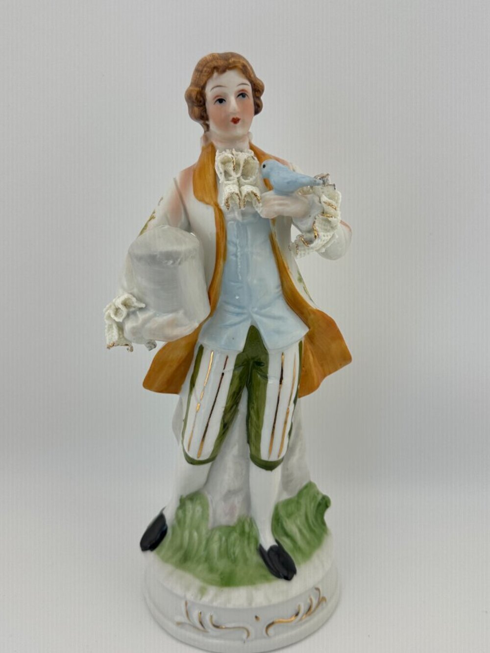 VINTAGE PORCELAIN COLONIAL CAVALIER BOY  WITH BIRD AND CAGE HAND-PAINTED 9.5"